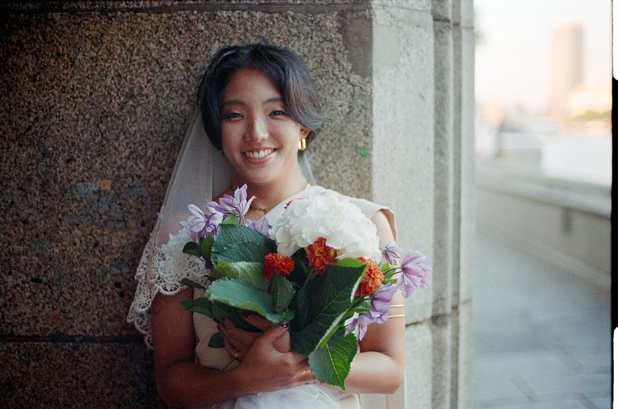 Moe holding her bouquet