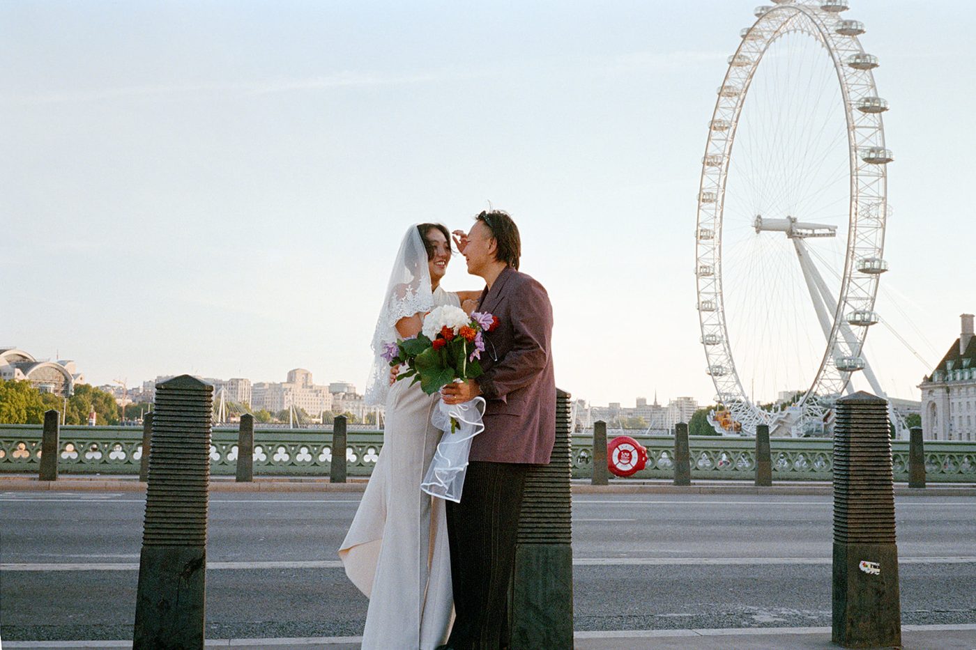 Jasper and Moe on Westminster Bridge with the London Eye behind them